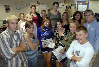 
Some of the staff of the Viking Voice, front row, left to right, Kyle Spurr, Kaitlyn Barton, Kara O'Connell, Amanda Mall, Jordan Puller and Cody Mee, also worked on the Coeur d'Alene High school paper last year. At far right is adviser Teri Asher. New staffers stand behind the front row. 
 (Jesse Tinsley / The Spokesman-Review)