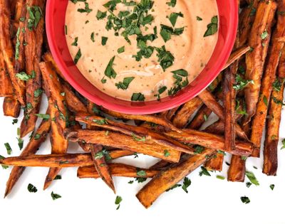 Spice up your backyard barbecue with sweet potato fries with chipotle-lime aioli. (Audrey Alfaro)