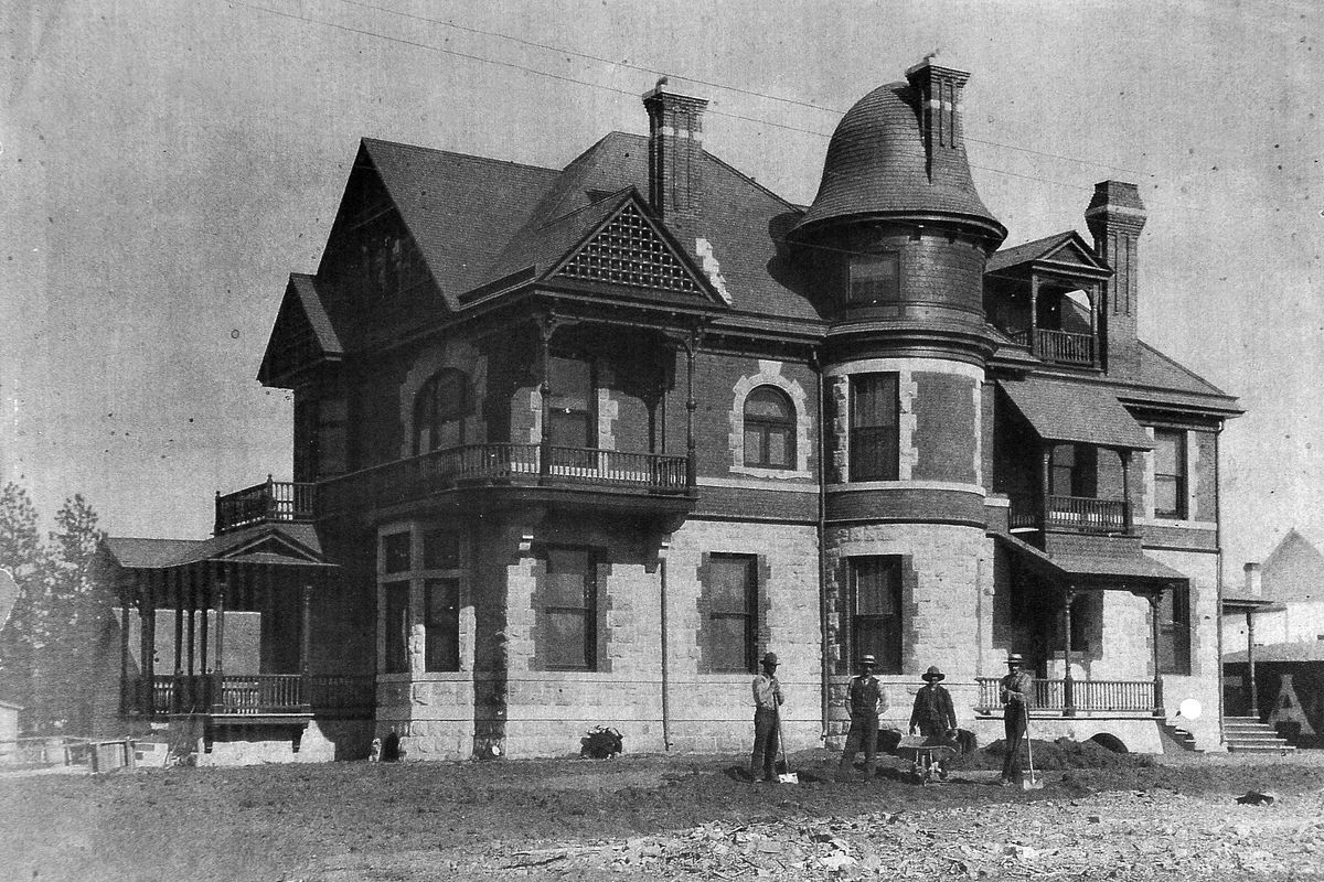 1889: Workers stand outside the home built by Bernhard Loewenberg and later owned by E.J. Roberts, for whom it is remembered.