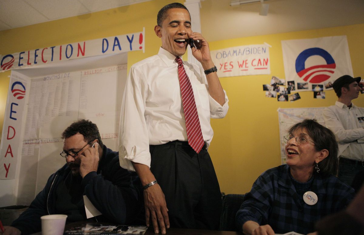 Barack Obama talks on the phone with a potential voter at his campaign office in Pittsburgh on Monday. Associated Press photos (Associated Press photos / The Spokesman-Review)