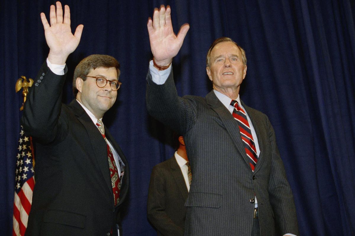 President George H.W Bush, right, and William Barr wave after Barr was sworn in as the new Attorney General of the United States at a Justice Department ceremony Nov. 26, 1991, in Washington. President Donald Trump said Friday he will nominate William Barr, former President George H.W. Bush’s attorney general, to serve in the same role. (Scott Applewhite / AP)
