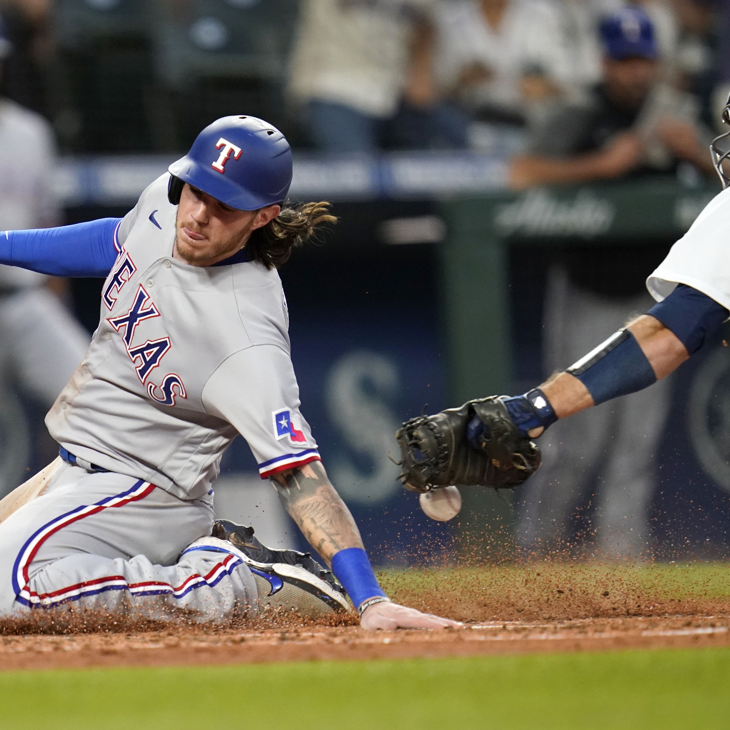 Rangers rally twice over Mariners, snap 14-game road skid