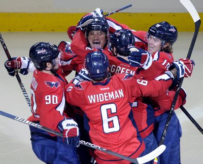 Alex Ovechkin, center, revved up Washington teammates early by scoring the game’s first goal just 88 seconds in. (Associated Press)