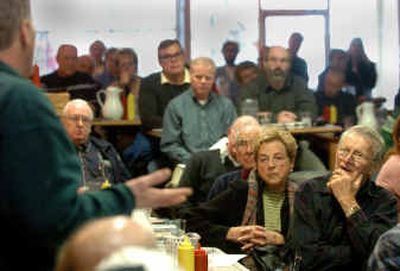 
Members of the Kootenai Environmental Alliance and other interested citizens listen to a scientist from the Idaho Department of Environmental Quality talk about the leak of polluted wastewater at the Burlington Northern and Sante Fe Co. refueling depot on the Rathdrum Prairie. The alliance held a panel discussion Thursday in Coeur d'Alene. 
 (Jesse Tinsley / The Spokesman-Review)