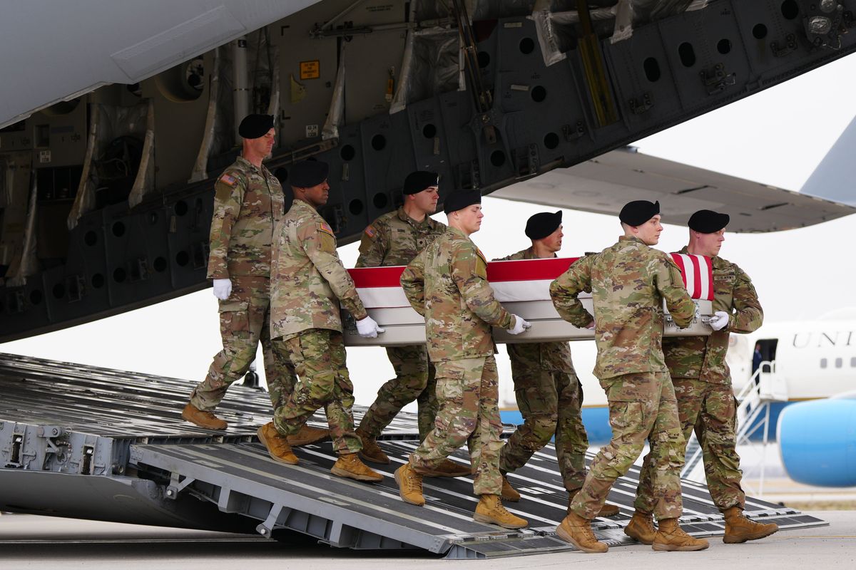 Service members carry the remains of six American service members killed in the U.S.-Israeli war against Iran, during the dignified transfer at Dover Air Force Base on Saturday, March 7, 2026. (Tierney L. Cross/The New York Times) (New York Times)