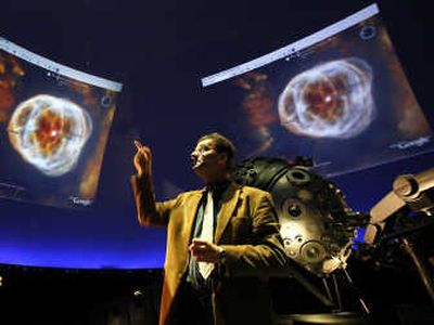 Thomas Krampe, head of the Hamburg planetarium, speaks during a presentation of Google Sky last month at the planetarium in Germany. Google Earth just launched Sky, a