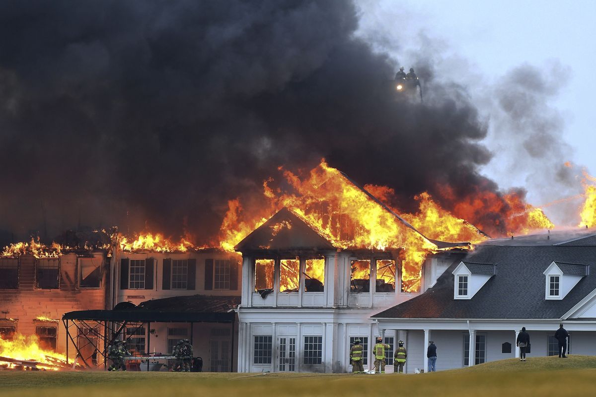 A fire burns at the main building at Oakland Hills Country Club in Bloomfield Township, Mich., on Thursday, Feb. 17, 2022. Firefighters battled a blaze at a more than century-old country club Thursday in suburban Detroit that