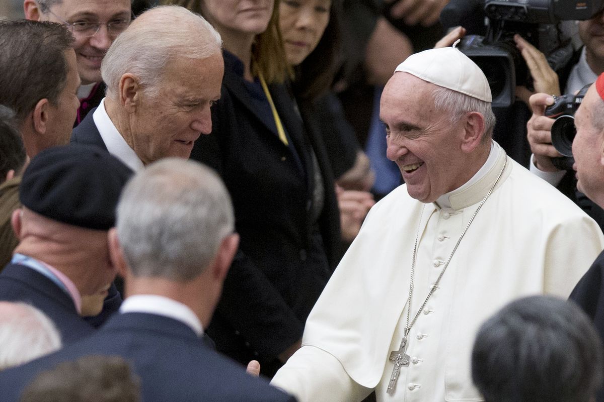 In this April 29, 2016 photo, Pope Francis shakes hands with Vice President Joe Biden as he takes part in a congress on the progress of regenerative medicine and its cultural impact, being held in the Pope Paul VI hall at the Vatican. The Vatican on Thursday, Oct. 29, 2021 abruptly canceled the planned live broadcast of President Joe Biden’s meeting with Pope Francis, pulling the plug on the eagerly-awaited audience and consolidating the limits on independent information coming out of the Holy See for the past 18 months. The Vatican press office provided no explanation for why the live broadcast of Biden’s visit had been trimmed to just the arrival of his motorcade in the courtyard of the Apostolic Palace.  (Andrew Medichini)