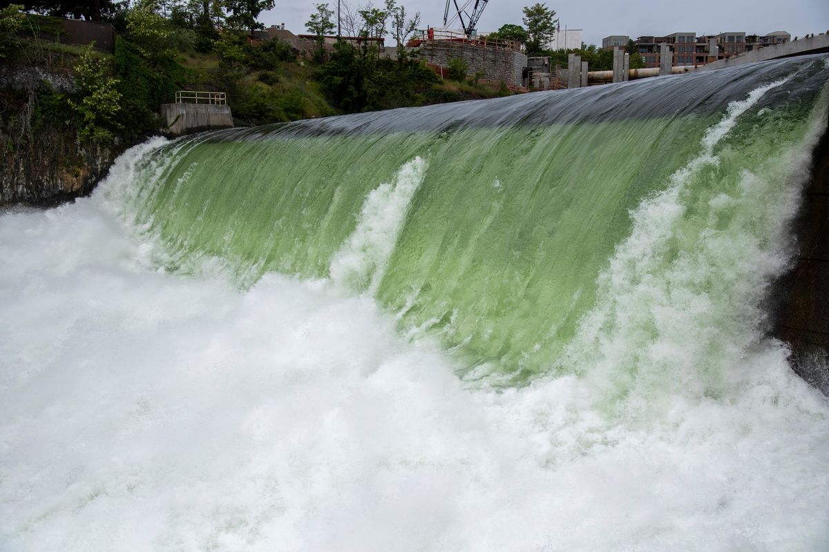 With a deafening roar, the spring runoff of the Spokane River cascades over the Avista spillway near Monroe Street in June.  (Jesse Tinsley/THE SPOKESMAN-REVIEW)