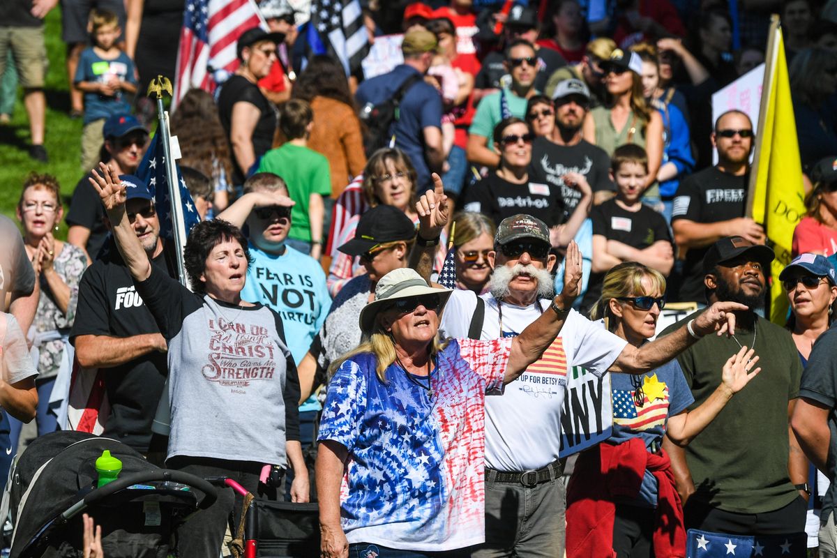 People sing inspirational religious songs during the Rally for Medical Freedom in Riverfront Park, Saturday, Sept. 25, 2021, in Spokane.  (DAN PELLE/THE SPOKESMAN-REVIEW)