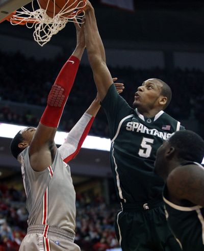 Michigan State's Adreian Payne (5) dunks over Ohio State's Jared Sullinger. Payne led the Spartans with 15 points. (Associated Press)