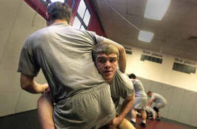 
Derek Kipperberg, facing at right, practices takedowns on Justin Pearch.  Both wrestlers are moving up a weight class to fill in for other wrestlers who couldn't keep up their grades or make weight.
 (Jesse Tinsley / The Spokesman-Review)
