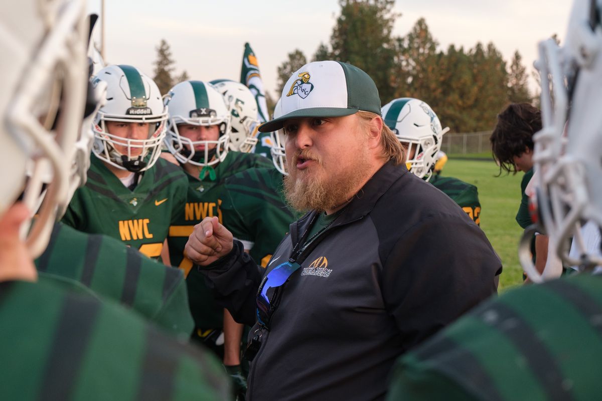 Northwest Christian head football coach Marshall Hart addresses his team before a Northeast 2B league game against Colfax on Saturday in Riverside. The Crusaders held off Colfax 27-24.  (Madison McCord/For The Spokesman-Review)