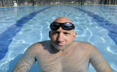 Carl Strong, aquatics supervisor for the city of Spokane, is chin deep in need for more lifeguards at the new city pools. (Dan Pelle / The Spokesman-Review)