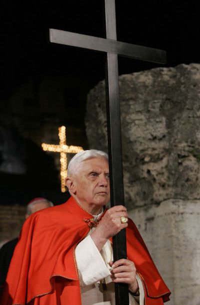 
Pope Benedict XVI holds a cross during the Via Crucis (Way of the Cross) torchlight procession on Good Friday in Rome. 
 (Associated Press / The Spokesman-Review)
