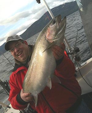 Clint Nicholson holds a fine rainbow trout caught in Lake Pend Oreille. (Courtesy)