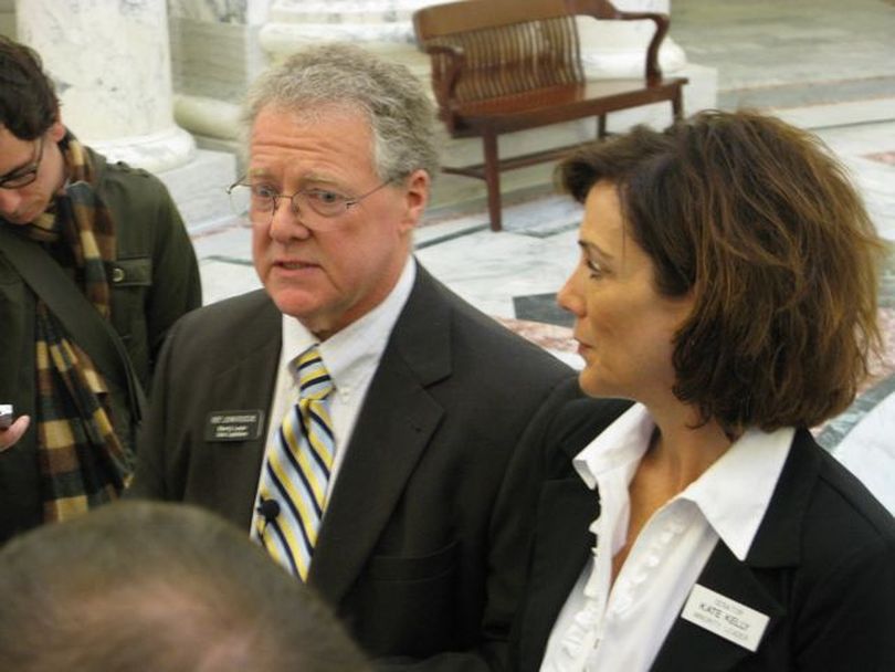 House Minority Leader John Rusche, D-Lewiston, left, and Senate Minority Leader Kate Kelly, D-Boise, right, talk about the just-concluded Idaho legislative session on Tuesday. (Betsy Russell)