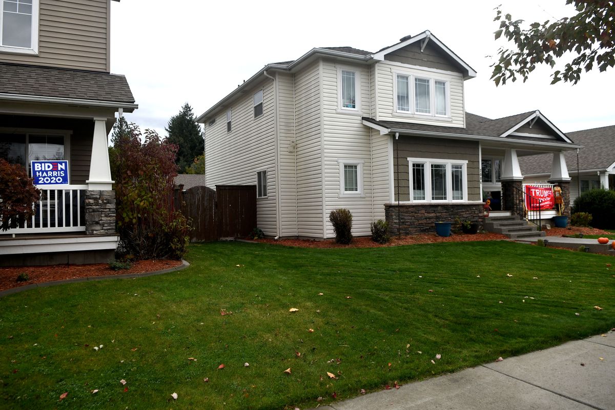 Neighbors in Post Falls display their choice for president with signage on their homes on Friday, Oct. 16, 2020. (Kathy Plonka/The Spokesman-Review)