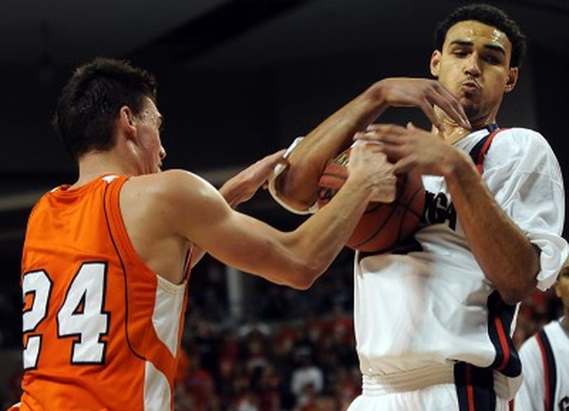 Gonzaga's Robert Sacre (21) pulls struggles for the ball against Pepperdine's Mike Hornbuckle (24) in the second half at McCarthey Athletic Center in Spokane, Wash. Saturday, February, 9, 2008. RAJAH BOSE The Spokesman-Review (Rajah Bose / The Spokesman-Review)