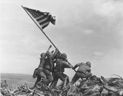 Joe Rosenthal won a Pulitzer Prize for this image of six World War II servicemen raising an American flag over battle-scarred Iwo Jima, taken on Feb. 23, 1945.
(File Associated Press / The Spokesman-Review)