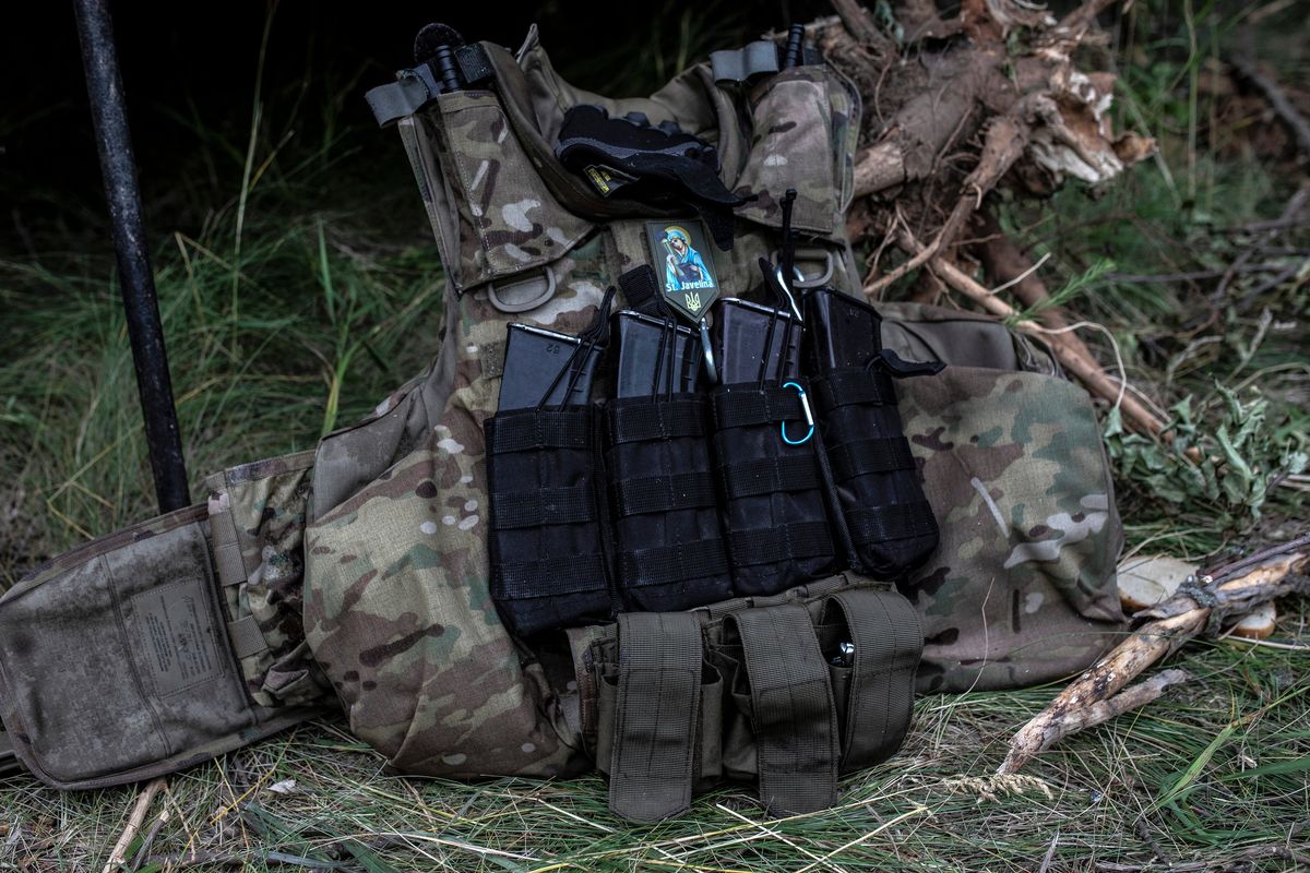 Ammunition magazines are mounted on a Ukrainian soldier