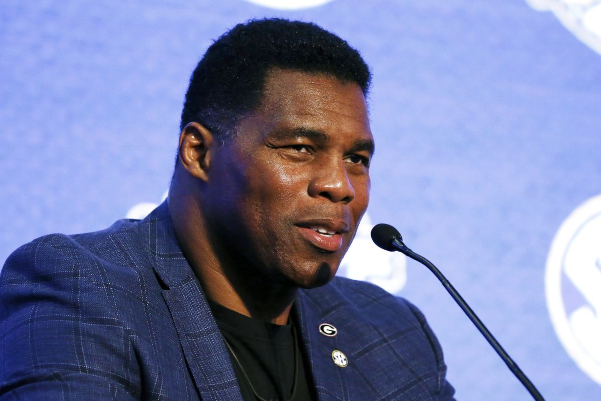 FILE - In this July 16, 2019, file photo, Herschel Walker talks about 150 years of college football during the NCAA college football Southeastern Conference Media Day in Hoover, Ala. Walker appears to have a coveted political profile for a potential Senate candidate in Georgia.  (Butch Dill)
