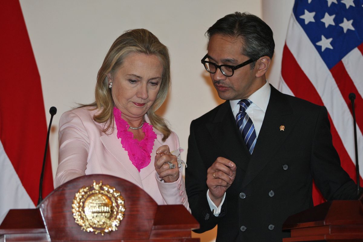 US Secretary of State Hillary Rodham Clinton, left, chats with Indonesian Foreign Minister Marty Natalegawa before the start of a joint press conference after their meeting in Jakarta, Indonesia, Monday, Sept. 3, 2012. (Dita Alangkara / Associated Press)