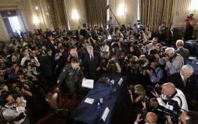 
Gen. David Petraeus, center, and U.S. Ambassador to Iraq Ryan Crocker arrive Monday on Capitol Hill. Associated Press
 (Associated Press / The Spokesman-Review)