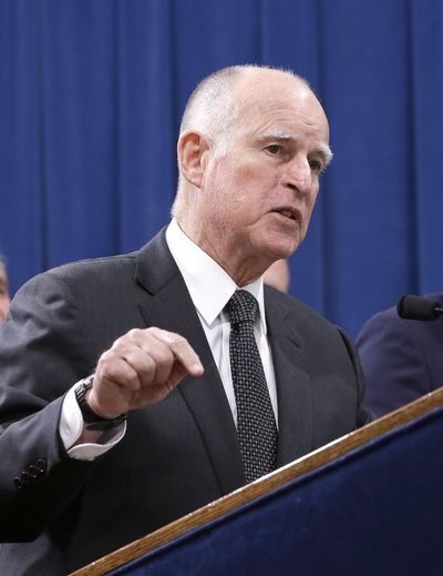 California Gov. Jerry Brown discusses proposed legislation to increase the state's minimum wage to $15 per hour by 2022, during a news conference in Sacramento, Calif., on Monday. (Rich Pedroncelli / Associated Press)