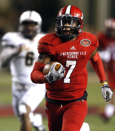 Jacksonville State quarterback Eli Jenkins (7) runs for a touchdown during the second half of an NCAA college football game against Charleston Southern, Friday, Dec. 11, 2015, in Jacksonville, Ala. (AP Photo/ Butch Dill) ORG XMIT: ALBD118