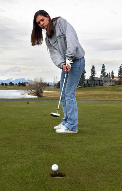 
East Valley High junior Ashley Saffle practices her putt during practice Tuesday at MeadowWood Golf Course in Liberty Lake. Saffle is one of the top returning golfers in the GSL.
 (Liz Kishimoto / The Spokesman-Review)