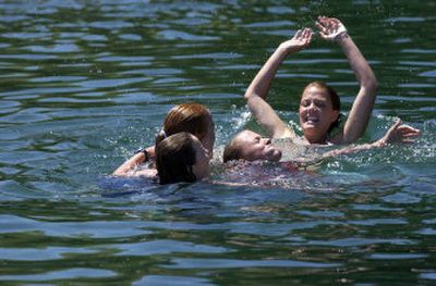 
 A refreshing dip in a cool lake on a hot summer day is one of the many alluring aspects of the camps being held in this region. 
 (File / The Spokesman-Review)