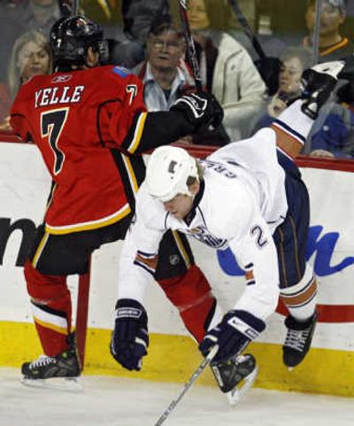 
Calgary's Stephane Yelle upends Edmonton's Matt Greene in the second period.Associated Press
 (Associated Press / The Spokesman-Review)