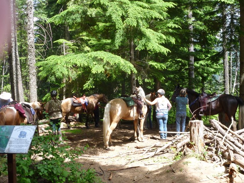 Horse riders gather at the cabin site high on the 7 mile loop trail in Liberty Lake County Park. (Rich Landers)