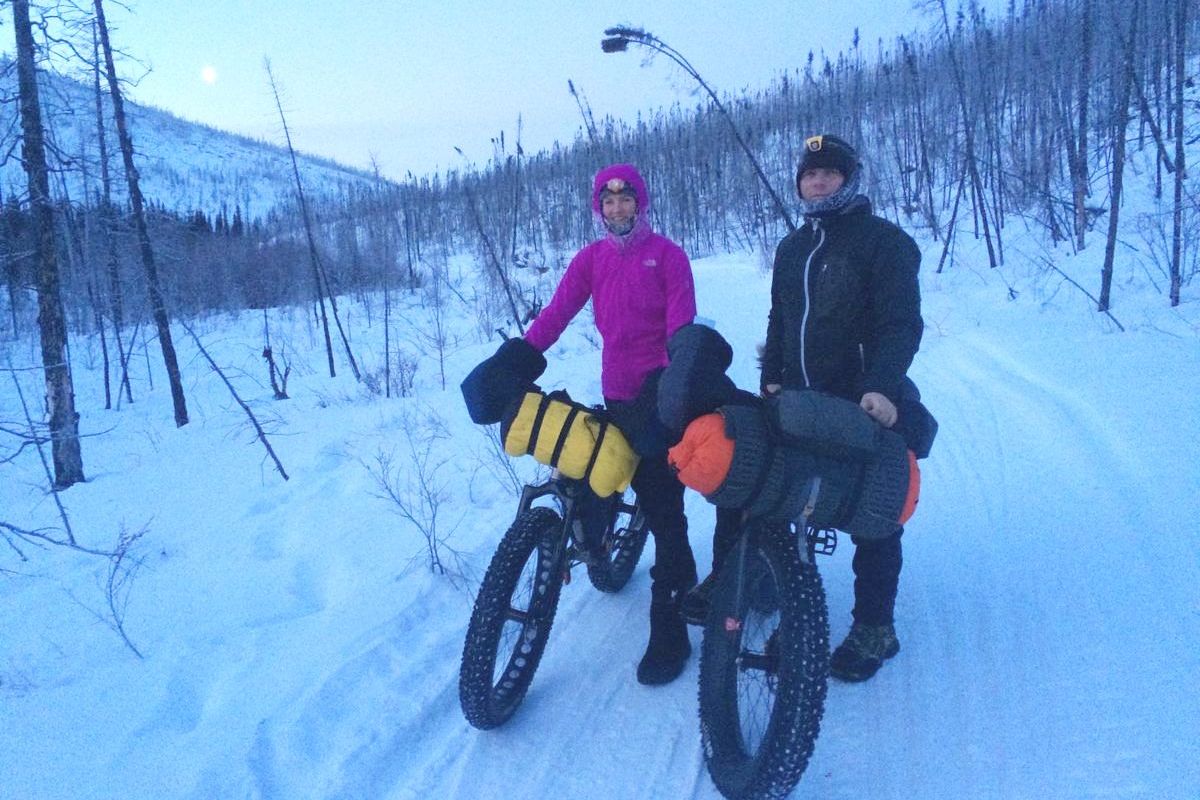 Jeff Oatley, right, poses with his wife Heather Best as he started a 1,000-mile pedal on the Yukon Quest sled dog trail from Fairbanks, Alaska, to Whitehorse, Yukon. Oatley made the ride in two weeks carrying a sleeping bag rated for minus 60 degrees. (Courtesy)
