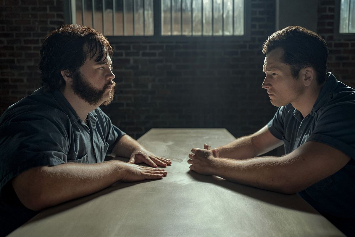 Paul Walter Hauser, left, and Taron Egerton in “Black Bird.” (Apple TV+)