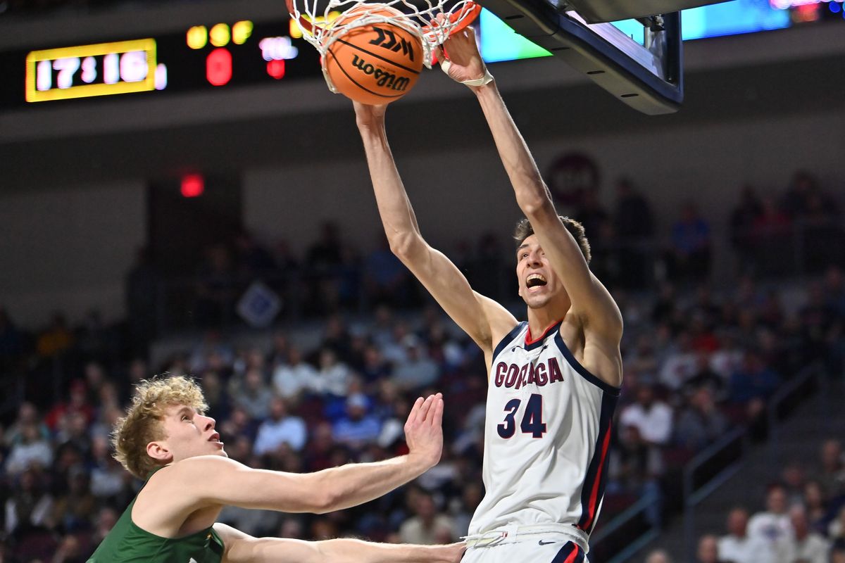 Gonzaga freshman Chet Holmgren dunks the ball over San Francisco forward Zane Meeks during Monday’s WCC Tournament semifinal at Orleans Arena in Las Vegas.  (Tyler Tjomsland/The Spokesman-Review)