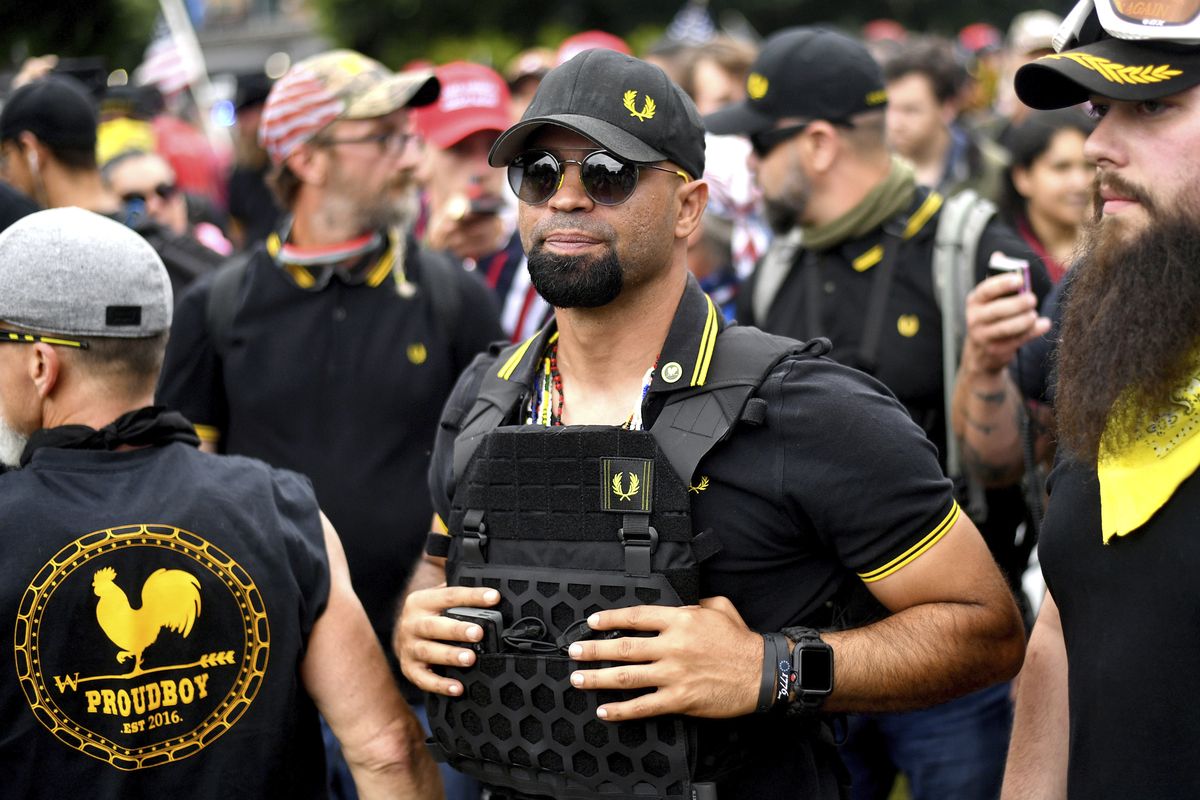 FILE - In this Aug. 17, 2019, file photo, Proud Boys chairman Enrique Tarrio rallies in Portland, Ore. Outside pressures and internal strife are roiling two far-right extremist groups after members were charged in the attack on the U.S. Capitol. Former President Donald Trump’s lies about a stolen 2020 election united an array of right-wing supporters, conspiracy theorists and militants on Jan. 6.  (Noah Berger)