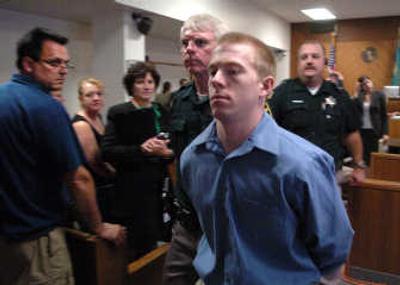 
Kevin Wayne Newland leaves Superior Court Judge Sam Cozza's courtroom after closing statements in his murder trial  Thursday. 
 (Dan Pelle / The Spokesman-Review)