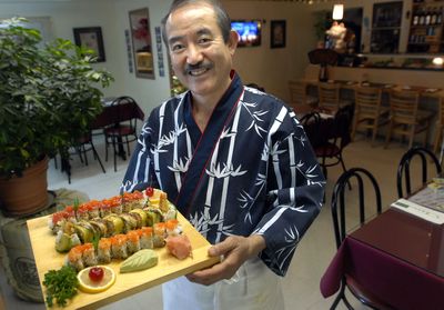Charlie Yamamoto, owner of Baek Chun Sushiyama, displays sushi at the restaurant in Airway Heights. (File / The Spokesman-Review)