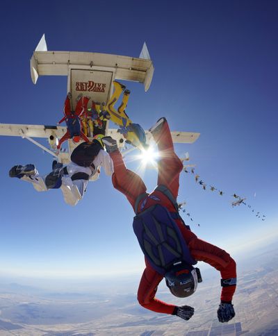 Members of the World Team begin a jump over Eloy, Ariz., in this photo taken Wednesday. (Associated Press)