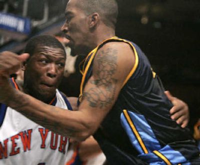 
Nate Robinson, left, squares off against Denver's J.R. Smith during Saturday's wild brawl in New York.
 (Associated Press / The Spokesman-Review)