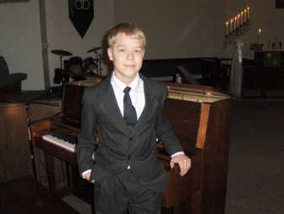 
David Ross, 14, started performing with the all-adult Spokane British Brass band when he was 13. 
 (JUAN JUAN MOSES / The Spokesman-Review)