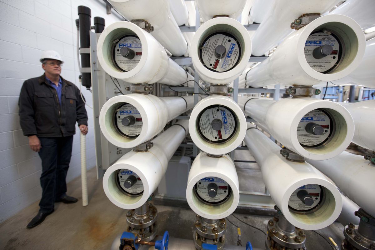 In this photo taken Thursday, Sept. 13, 2012,  city engineer Richard Simonitch looks over rows of membranes that filter water at a desalination plant in Sand City, Calif.  Not long ago, the idea of squeezing salt from the ocean to make clean drinking water was embraced warmly in thirsty California with its cycles of drought and growing population. But it has not panned out the way many hoped. Desalination plants are costing more to build; they