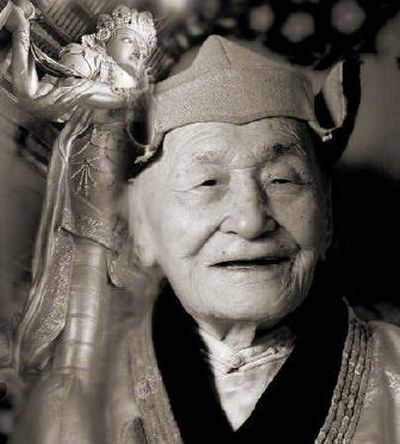 
This photo, provided by photographer Jerry Friedman, shows 110-year-old Tibetan Buddhist lama Damchaagiin Gendendarjaa in Ulan Bator, Mongolia in February 2003. The picture, which is a composite photo that includes the image of a Buddha statue at left, is among the images in Friedman's book.
 (Associated Press/Jerry Friedman / The Spokesman-Review)
