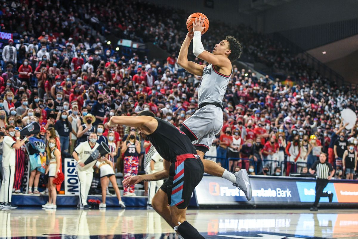 After a steal, Gonzaga guard Andrew Nembhard scores over Loyola Marymount guard Joe Quintana, Thursday, Jan. 27, 2022 in the McCarthey Athletic Center.  (Dan Pelle/THE SPOKESMAN-REVIEW)