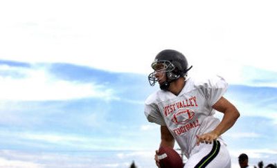 West Valley High's Cam Wieber runs through a drill during a practice at West Valley Monday.
(Liz-Anne Kishimoto / The Spokesman-Review)