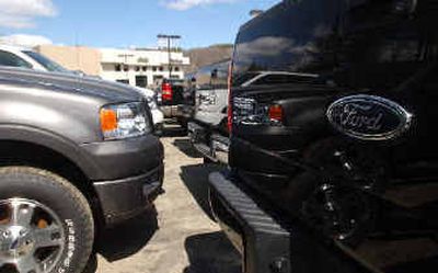 
New trucks at a Ford dealership are seen in Montpelier, Vt., Monday. Ford Motor Co. shares fell to their lowest level in more than a year Monday.  
 (Associated Press / The Spokesman-Review)