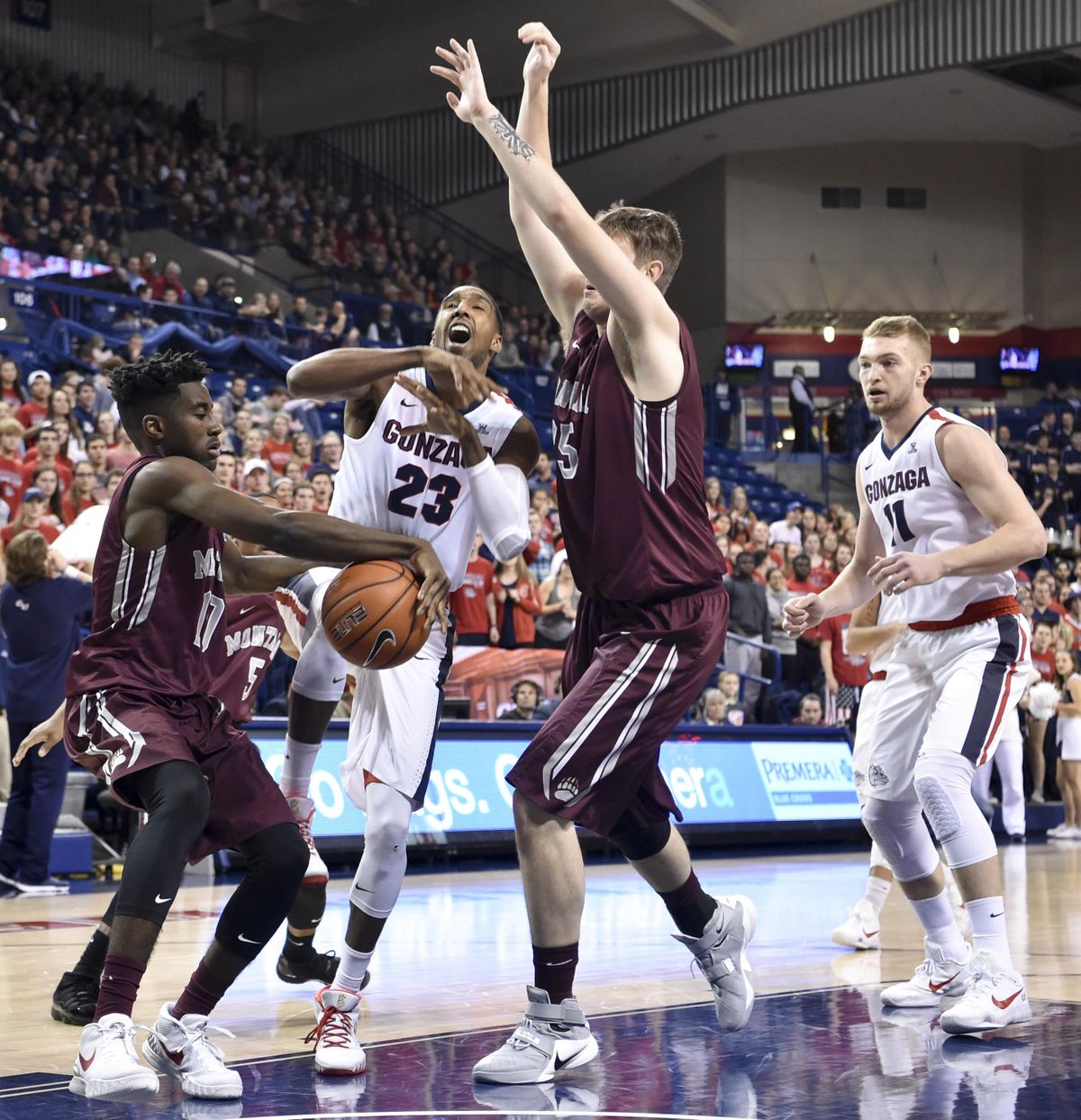 Gonzaga guard Eric McClellan (23) is stripped of the ball by Montana as he drives to the hoop during the first half of a college basketball game on Tuesday, Dec 8, 2015, at McCarthey Athletic Center in Spokane, Wash. (Tyler Tjomsland / The Spokesman-Review)