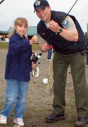 
Wildlife enforcement officer Lenny Hahn of Spokane, right, volunteered at a Kid Fishing event in May.Courtesy Wash. Dept. of Fish and Wildlfie
 (Courtesy Wash. Dept. of Fish and Wildlfie / The Spokesman-Review)